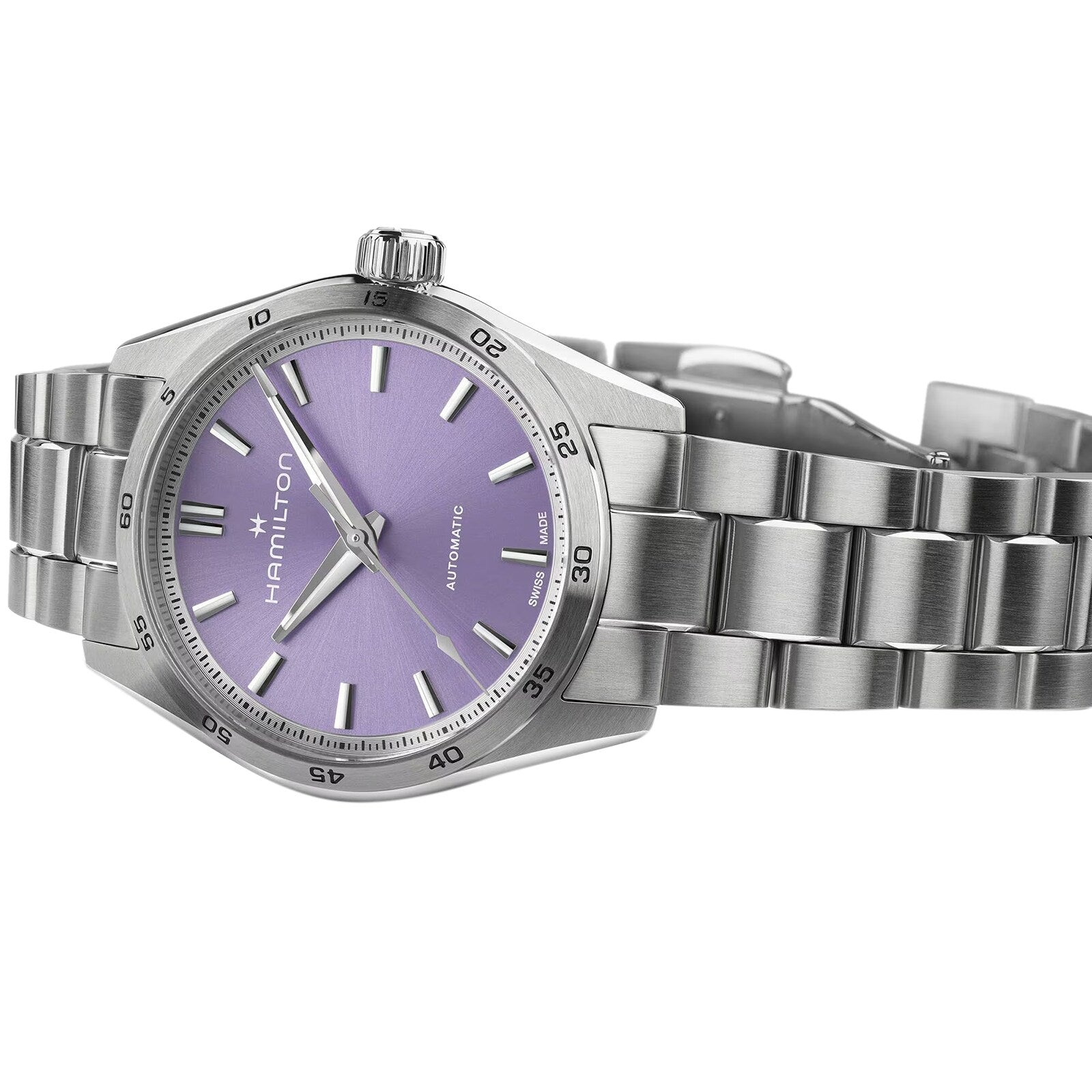 The Hamilton Jazzmaster Performer Auto features a lilac dial with silver hour markers, an automatic movement, and a stainless steel link bracelet, all elegantly designed under the renowned Hamilton brand.