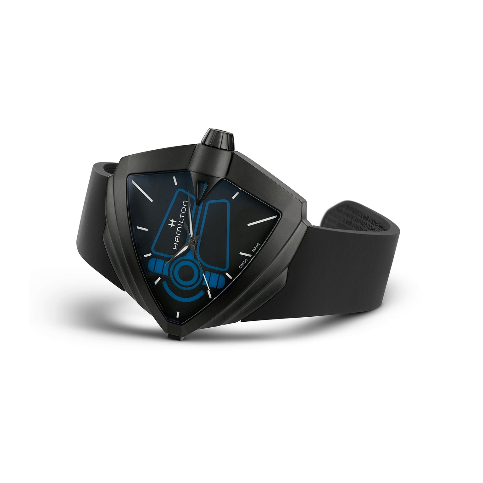 The Hamilton Ventura XXL Bright Dune Limited Edition is a black, triangular wristwatch with a blue geometric dial and black rubber strap, shown on a white background. This piece comes in special commemorative packaging.