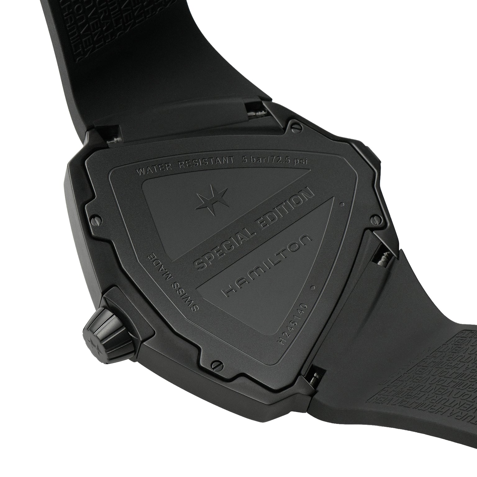 Close-up of the back of a black Hamilton Ventura XXL Bright Dune Limited Edition wristwatch showing Special Edition and water resistance details, with the partially open strap visible.