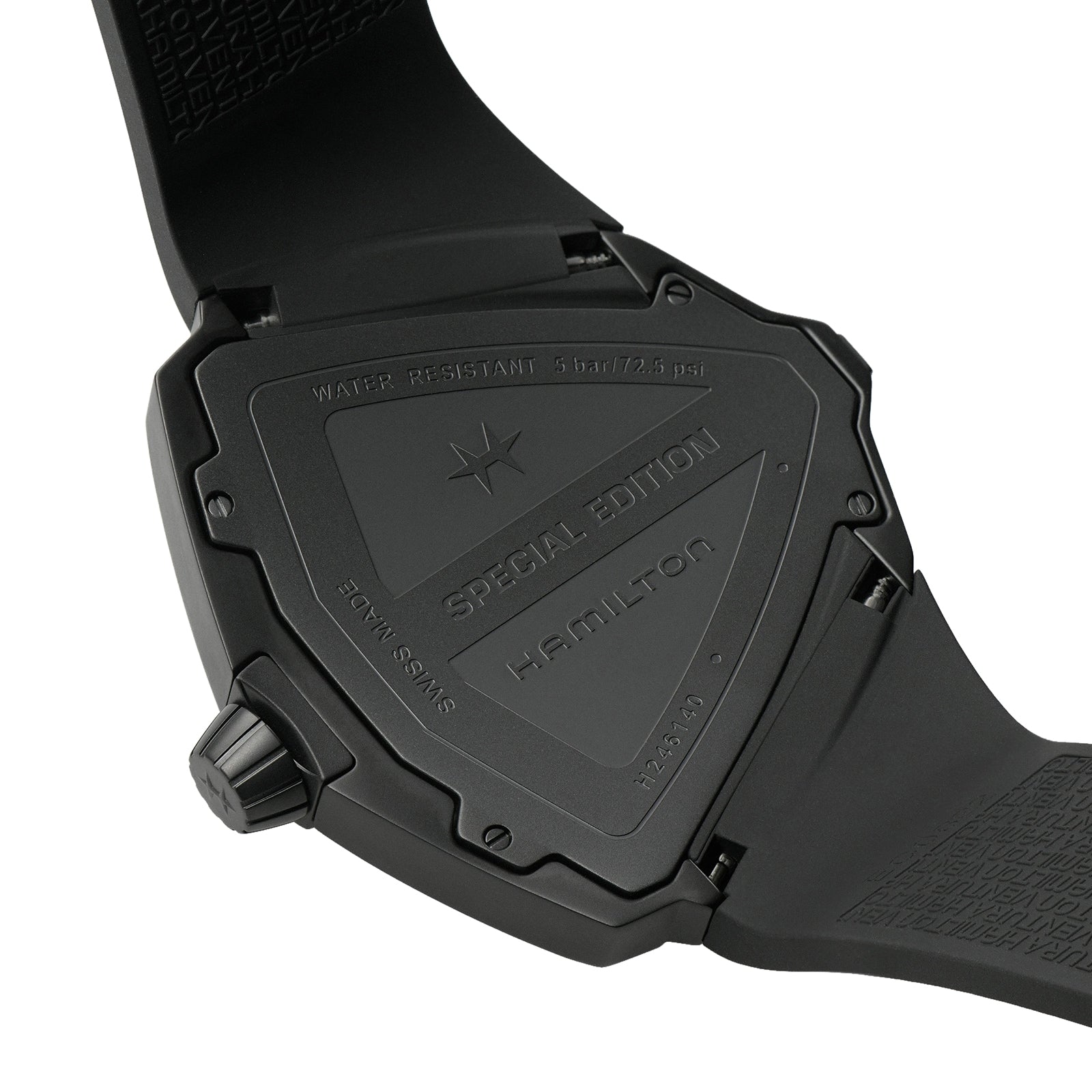 Close-up of the back of a black Hamilton Ventura XXL Bright Dune Limited Edition wristwatch showing Special Edition and water resistance details, with the partially open strap visible.