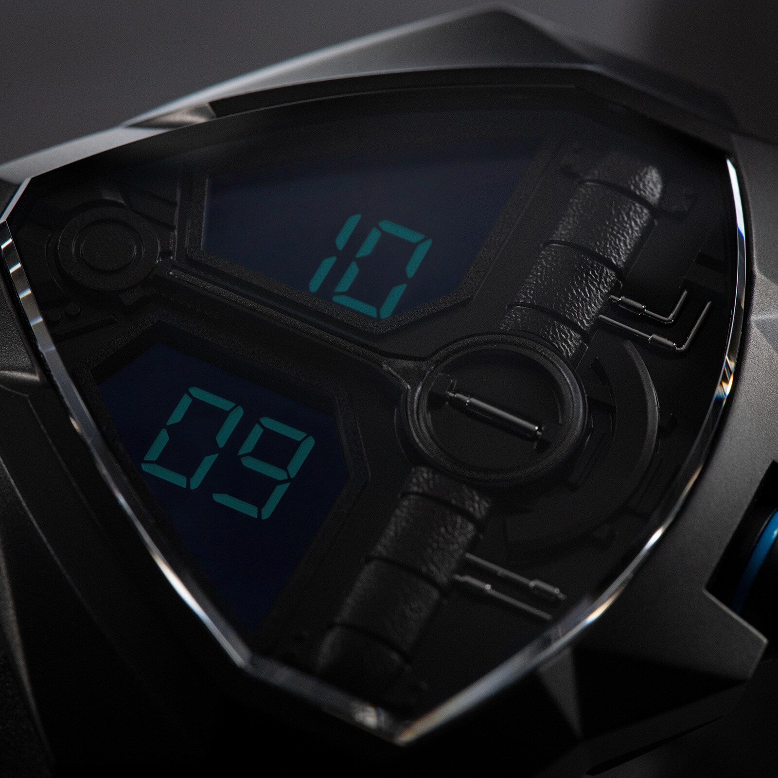 Close-up of the Hamilton Ventura Edge Dune Limited Edition watch face, displaying 10:09 in blue on a futuristic black angular casing, inspired by the Desert Watch featured in Dune Part Two.
