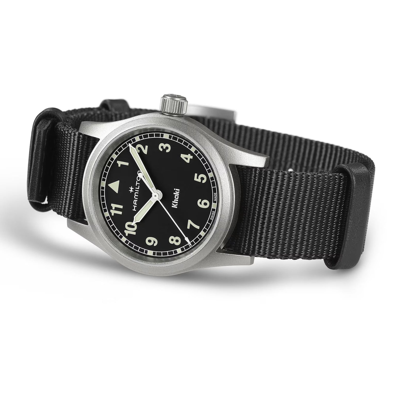 The Hamilton Khaki Field Quartz 33mm, a military-inspired watch, features a black dial with white numerals, luminous hands, and a black NATO strap. Shown angled on a white background.