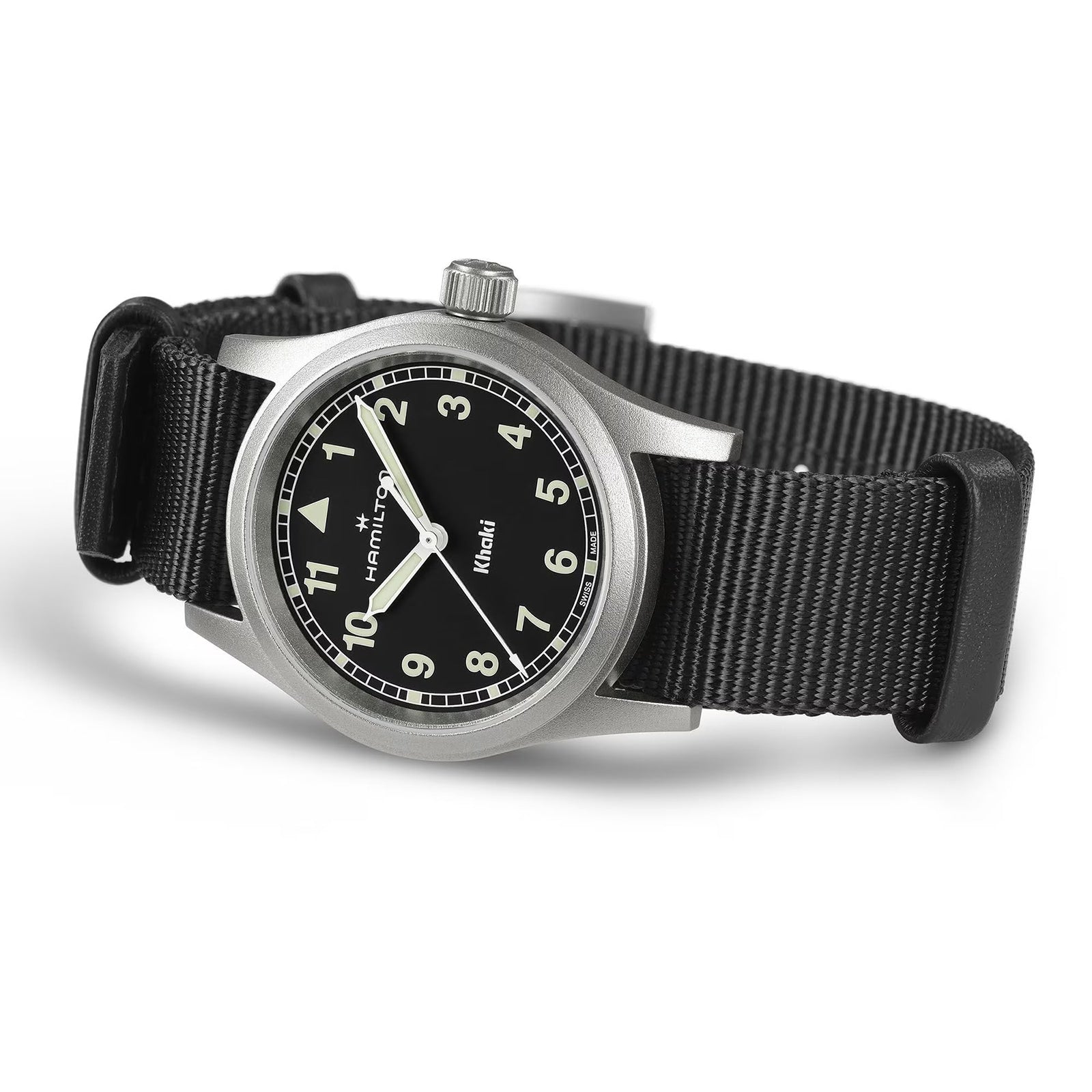 The Hamilton Khaki Field Quartz 33mm, a military-inspired watch, features a black dial with white numerals, luminous hands, and a black NATO strap. Shown angled on a white background.