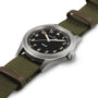 The Hamilton Khaki Field Quartz features a black dial with beige numerals and an olive green fabric strap accented by brown leather.