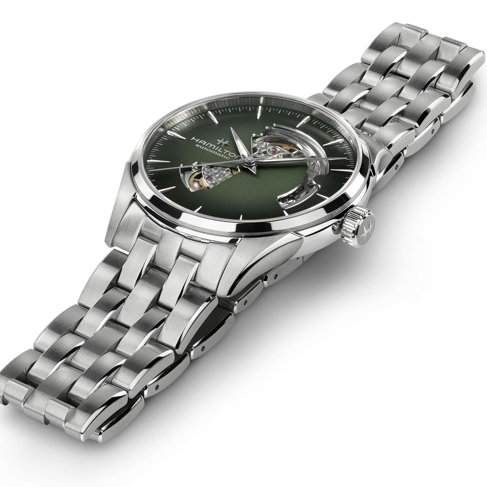 The Hamilton Jazzmaster Open Heart Auto 42mm is a silver wristwatch with a green dial, metal link band, and an exposed gear mechanism.