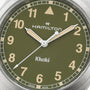 Close-up of a green Hamilton Khaki Field Quartz 38mm watch face displaying the time as 2:38:36.
