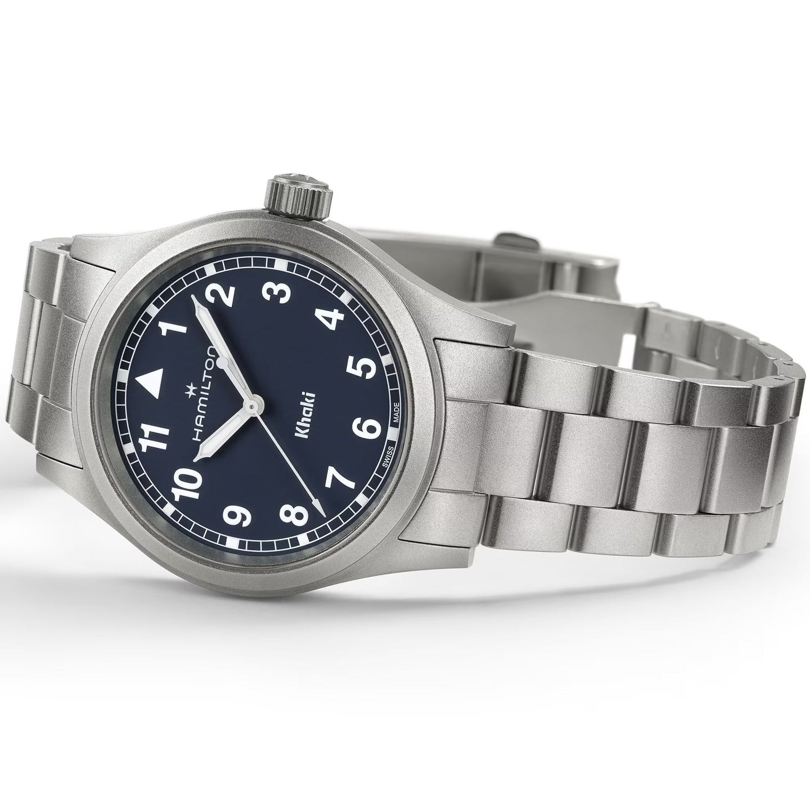 The Hamilton Khaki Field Quartz 38mm, featuring a stainless steel case, blue dial with white numerals, and a silver bracelet, lies at an angle.