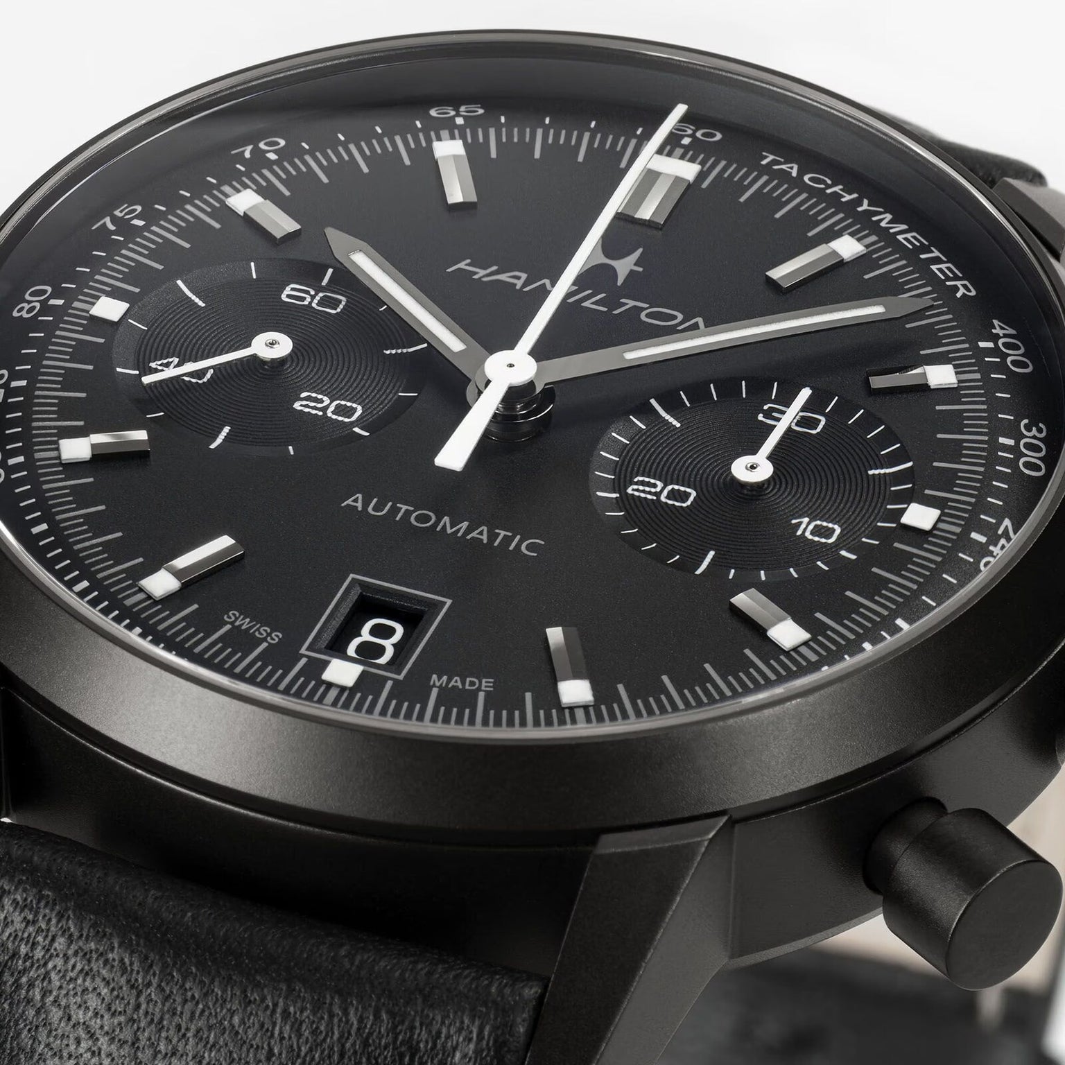 Close-up of a Hamilton American Classic Intra-Matic Auto Chrono, a black automatic chronograph watch featuring two subdials and a date display.