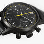 Hamilton American Classic Intra-Matic Auto Chrono with yellow accents, black leather strap, and a tachymeter bezel.