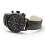 The Hamilton American Classic Intra-Matic Auto Chrono is a black chronograph watch with a black leather strap, yellow perforations, and tachymeter markings.