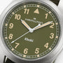 Close-up of the Hamilton Khaki Field Quartz 38mm watch, featuring an olive green dial with beige hour markers and hands.