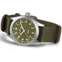 Hamilton Khaki Field Quartz 38mm watch with an olive green dial and strap, silver case, and white numerals and hands.