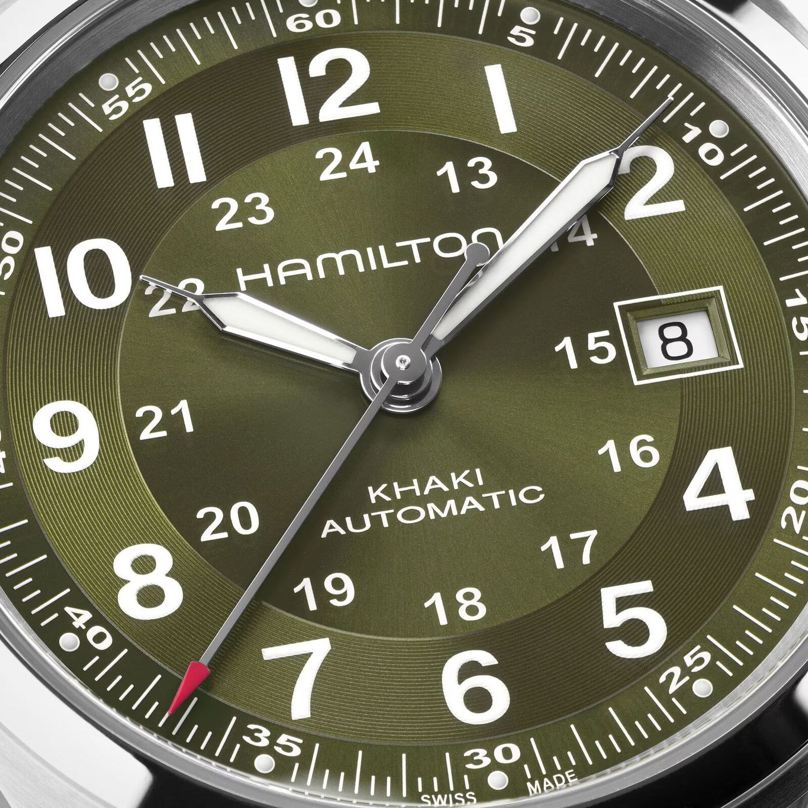 Close-up of a green Hamilton Khaki Field Auto 42mm watch displaying the date as the 8th.