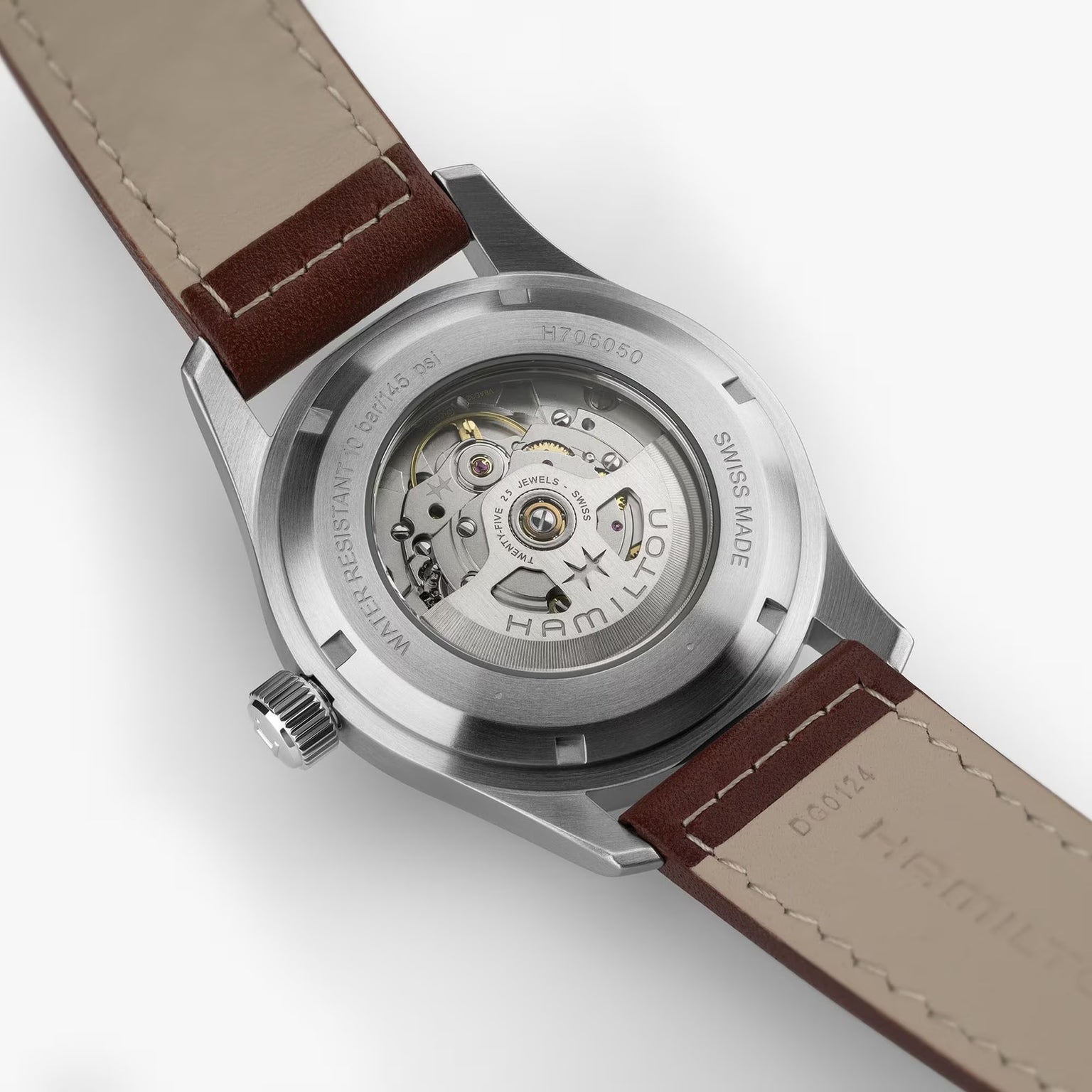 Close-up of the back of the Hamilton Khaki Field Auto 42mm, highlighting its exposed automatic movement and leather strap.