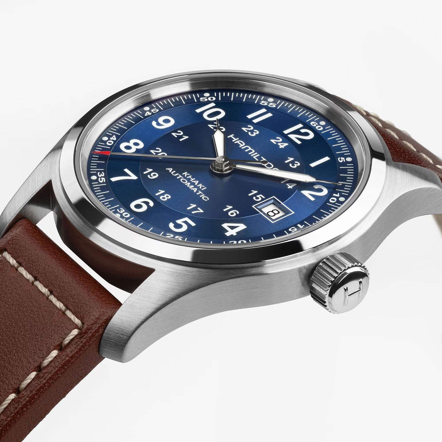 Hamilton Khaki Field Auto 42mm by Hamilton with a blue dial, brown leather strap, and date display at 3 oclock.