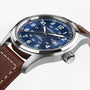 Hamilton Khaki Field Auto 42mm by Hamilton with a blue dial, brown leather strap, and date display at 3 oclock.