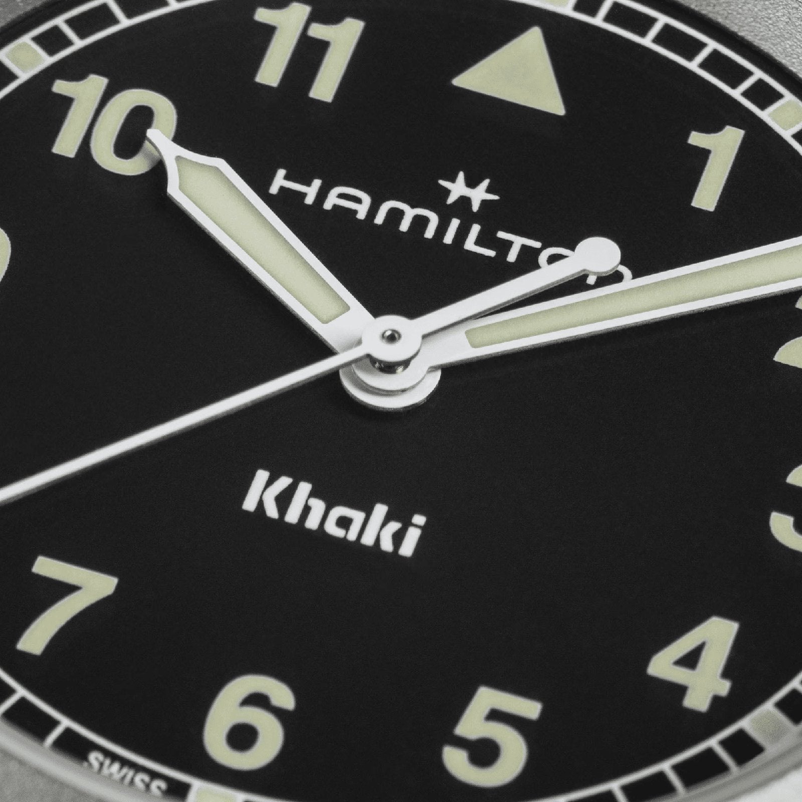 Close-up of the Hamilton Khaki Field Quartz 33mm, featuring luminous hands and bold Arabic numerals on a black dial—built for adventure. Time displayed: 10:08:37.