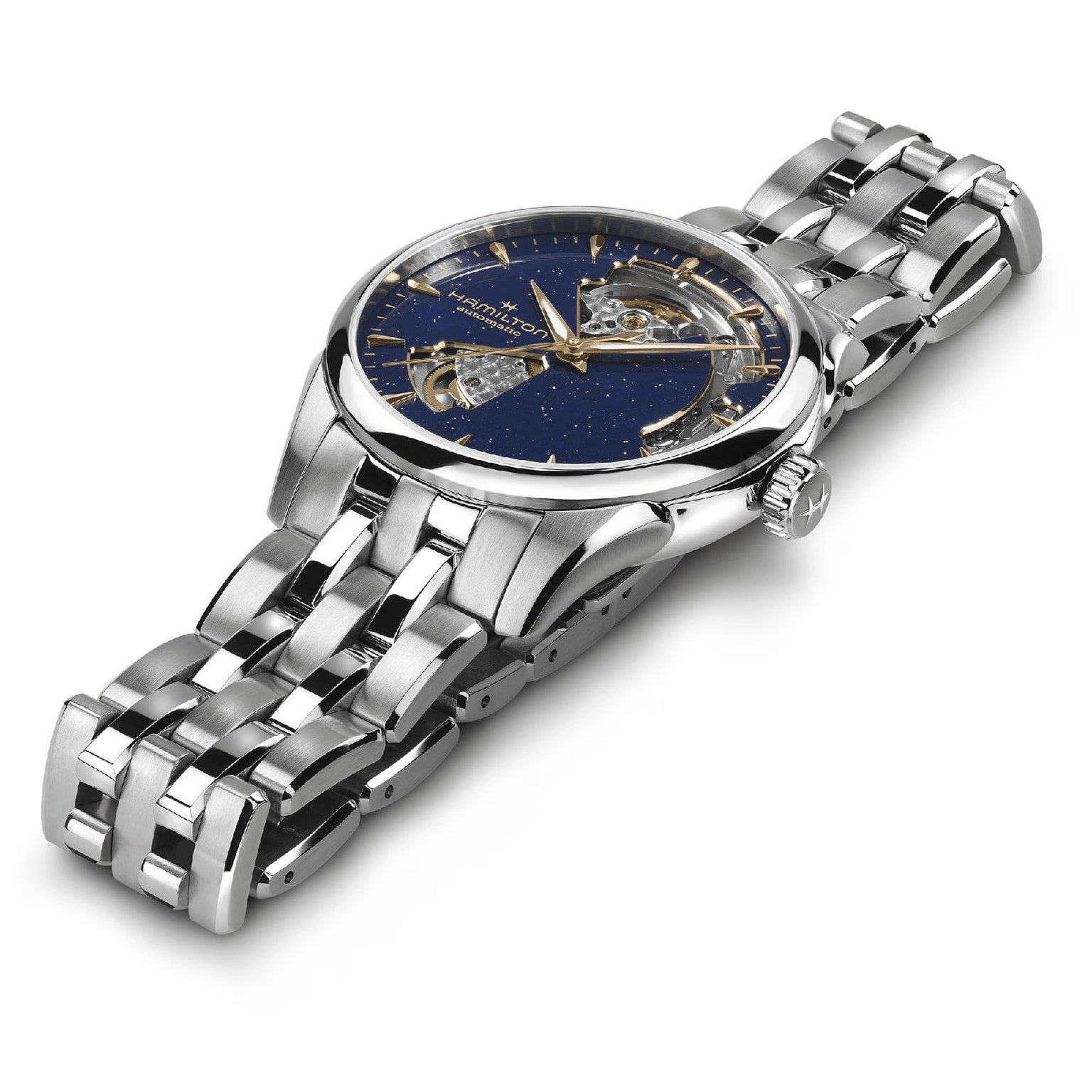 The Hamilton Jazzmaster Open Heart Lady Auto is displayed at an angle, featuring a blue skeleton dial with gold accents, automatic movement, and a stainless steel bracelet for an elegant look.