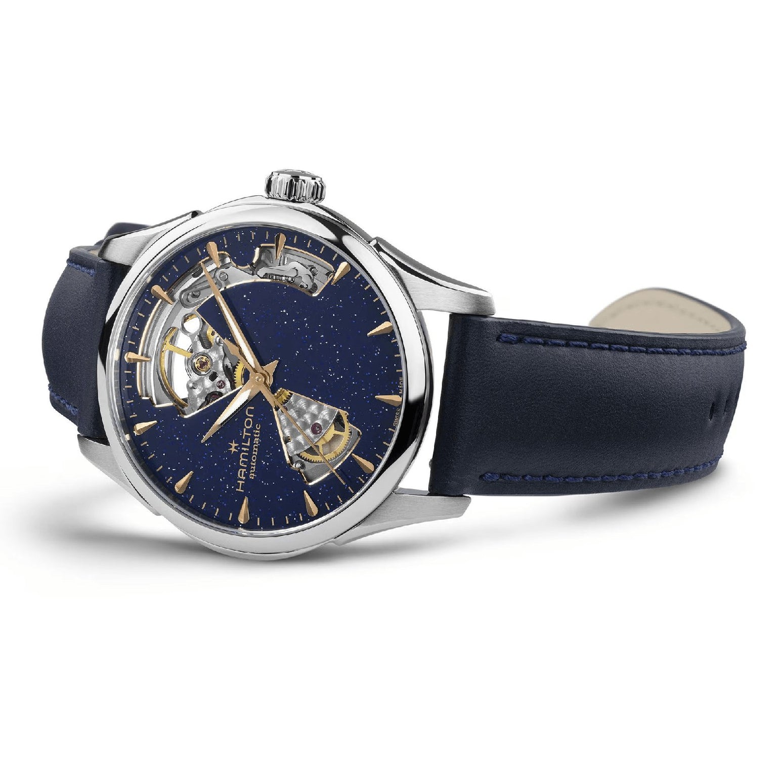 The Hamilton Jazzmaster Open Heart Lady Auto is a silver dress watch with a blue leather strap, an openwork dial that reveals its automatic movement, and gold hour markers on a star-patterned face.