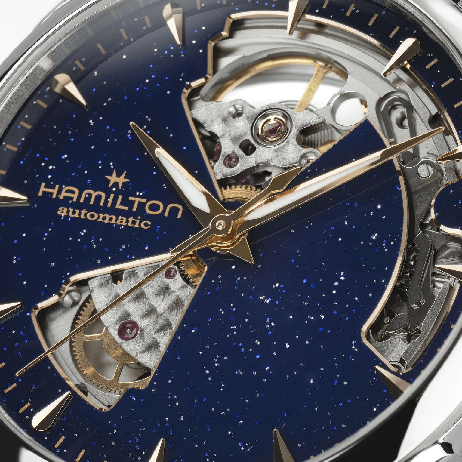 Close-up of the Hamilton Jazzmaster Open Heart Lady Auto dress watch with a blue speckled dial and exposed automatic movement visible through its signature open-heart design.