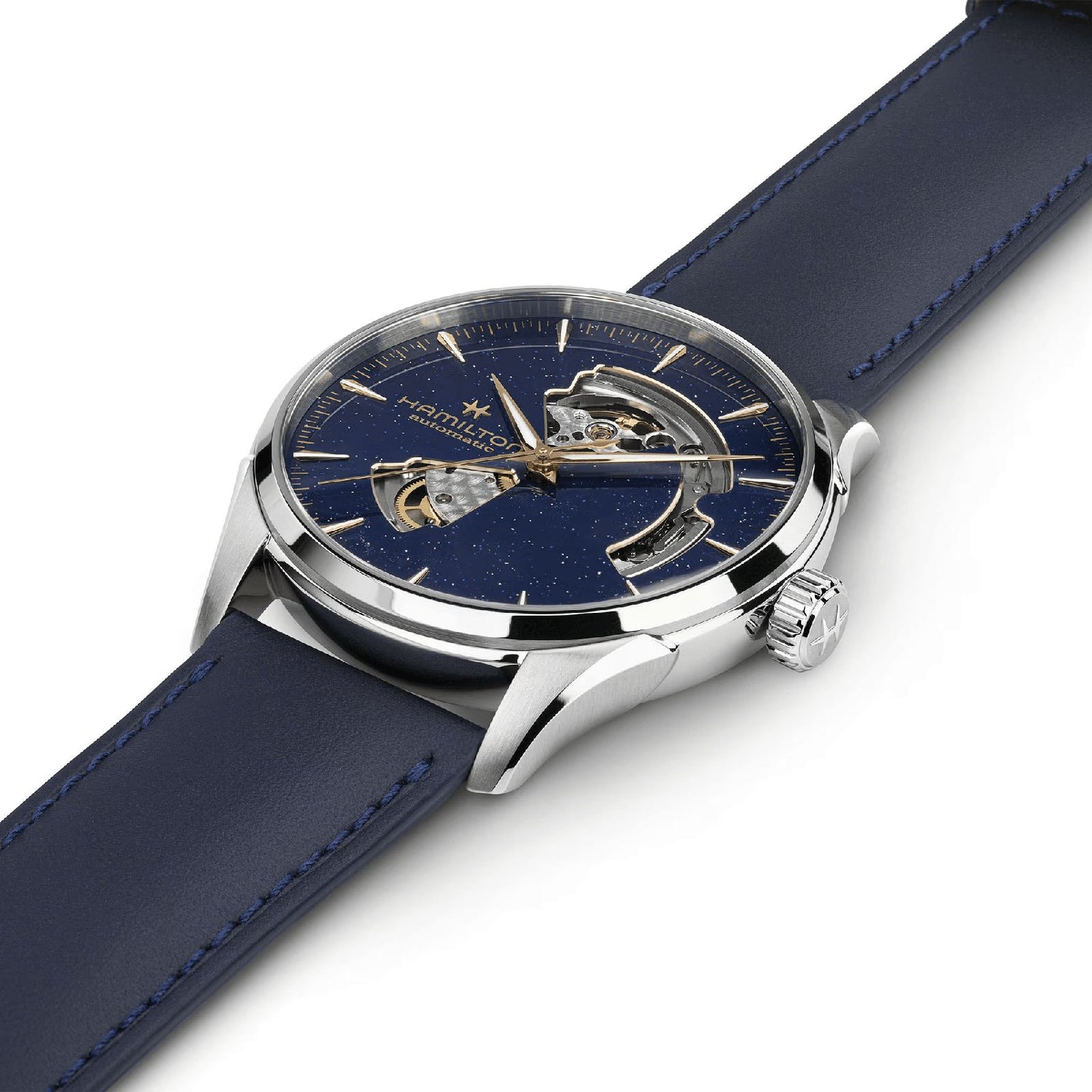 A close-up of the Hamilton Jazzmaster Open Heart Auto 42mm wristwatch with a dark blue leather strap, visible automatic movement through its partial open-heart dial, and a silver case, elegantly displayed at an angle on a white background.