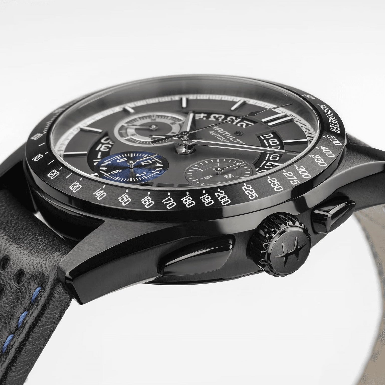 Close-up side view of the Hamilton Jazzmaster Performer Autochrono 42mm in black, featuring a leather strap, three chronograph subdials, and a tachymeter bezel.