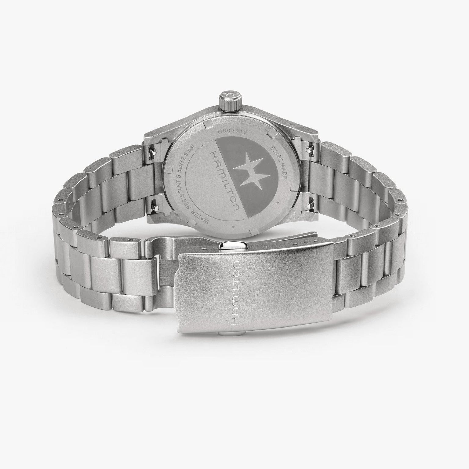 The Hamilton Khaki Field Quartz 33mm wristwatch is shown from the back, highlighting its stainless steel clasp, bracelet links, and engraved case back—an exploration-ready and durable timepiece.