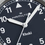 Close-up of a Hamilton Khaki Field Quartz 33mm watch face at 9:05:36, featuring white numerals and bold hands on a navy blue dial—an ideal adventure watch from Hamilton.