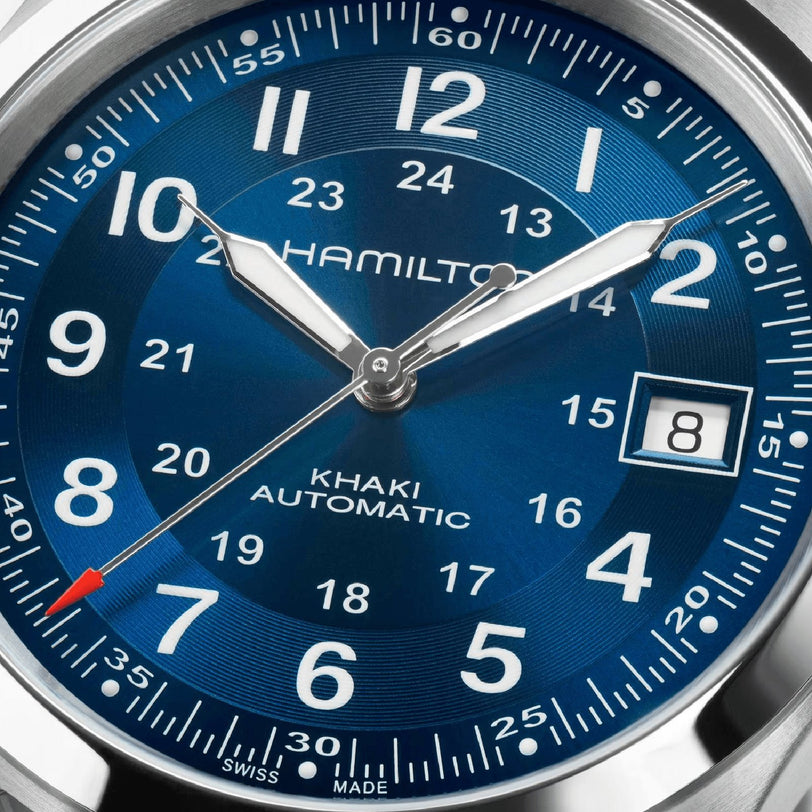 Close-up of the Hamilton Khaki Field Auto 38mm watch showing a blue sunray dial, the time at 1:41:38, and a date window displaying 8.