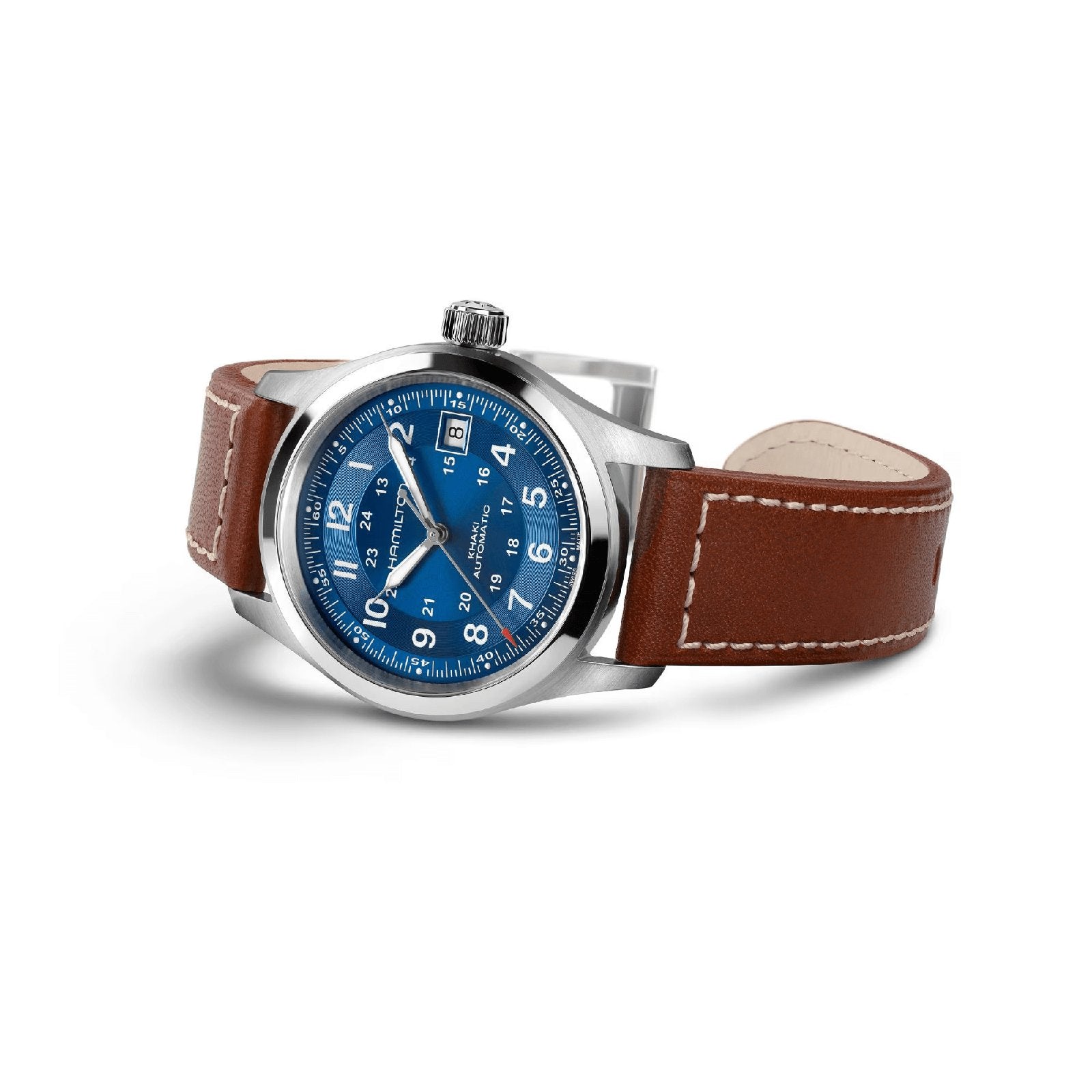 The Hamilton Khaki Field Auto 38mm features a stainless steel case, navy sunray dial with white numerals and date display, and a brown leather strap with white stitching. Powered by the H-10 automatic caliber, shown angled on a white background.