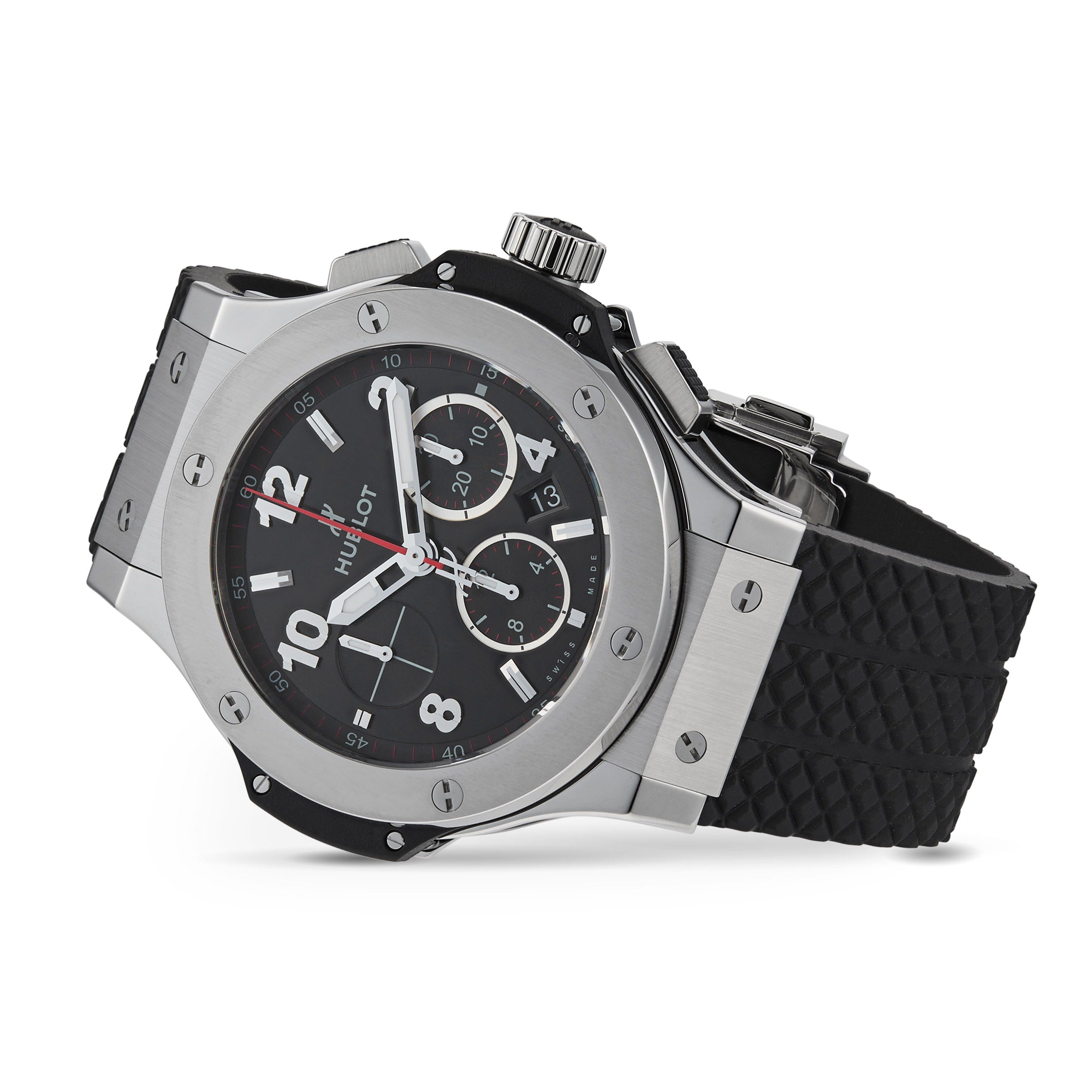 A Hublot Big Bang Original Steel chronograph watch in black and silver with a black textured rubber strap, displayed at an angle on a white background, highlights its sporty aesthetic.