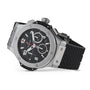 A Hublot Big Bang Original Steel chronograph watch in black and silver with a black textured rubber strap, displayed at an angle on a white background, highlights its sporty aesthetic.