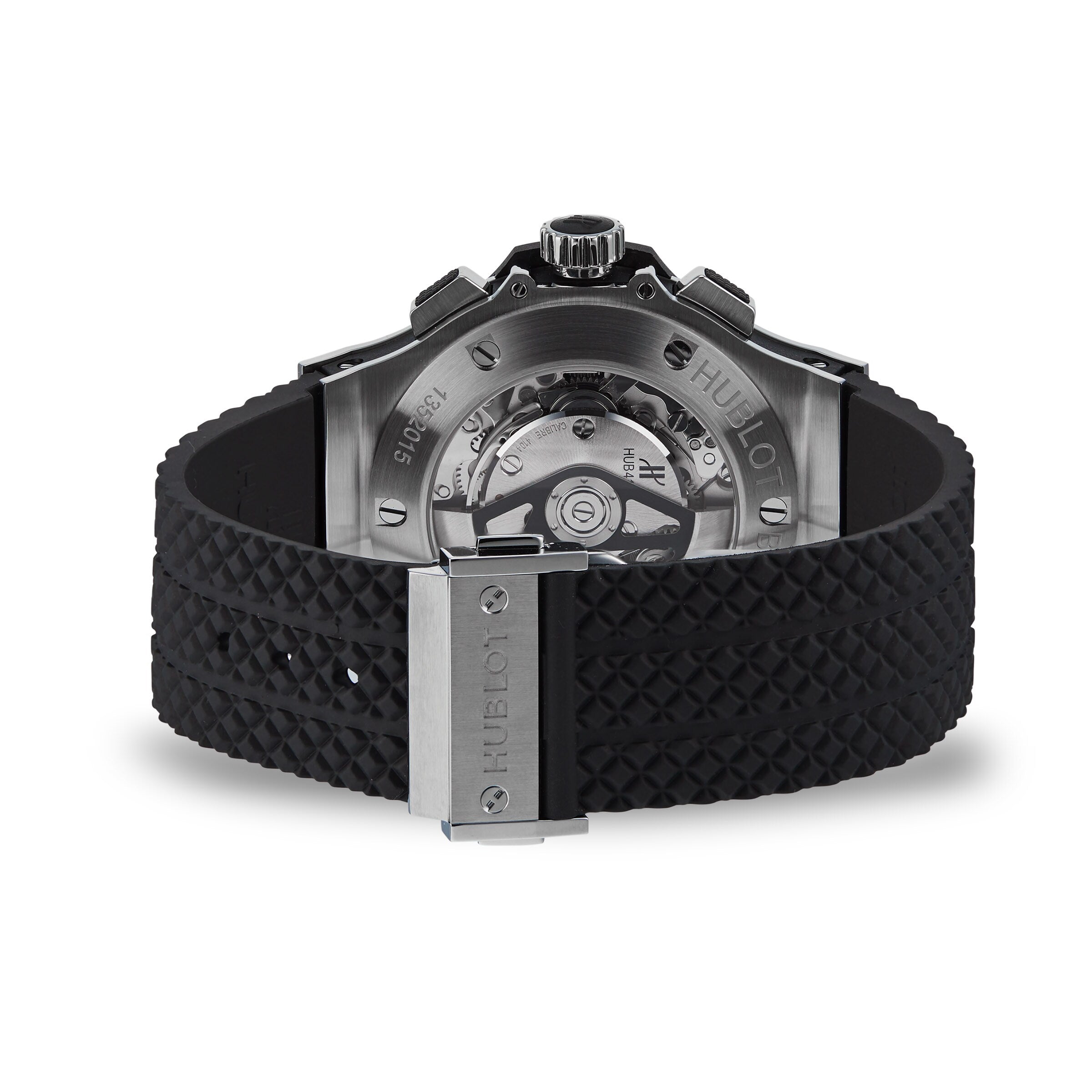 The image displays the back of the Hublot Big Bang Original Steel, featuring a black textured rubber strap and a visible automatic movement through its transparent case back, emphasizing its sport-inspired style.