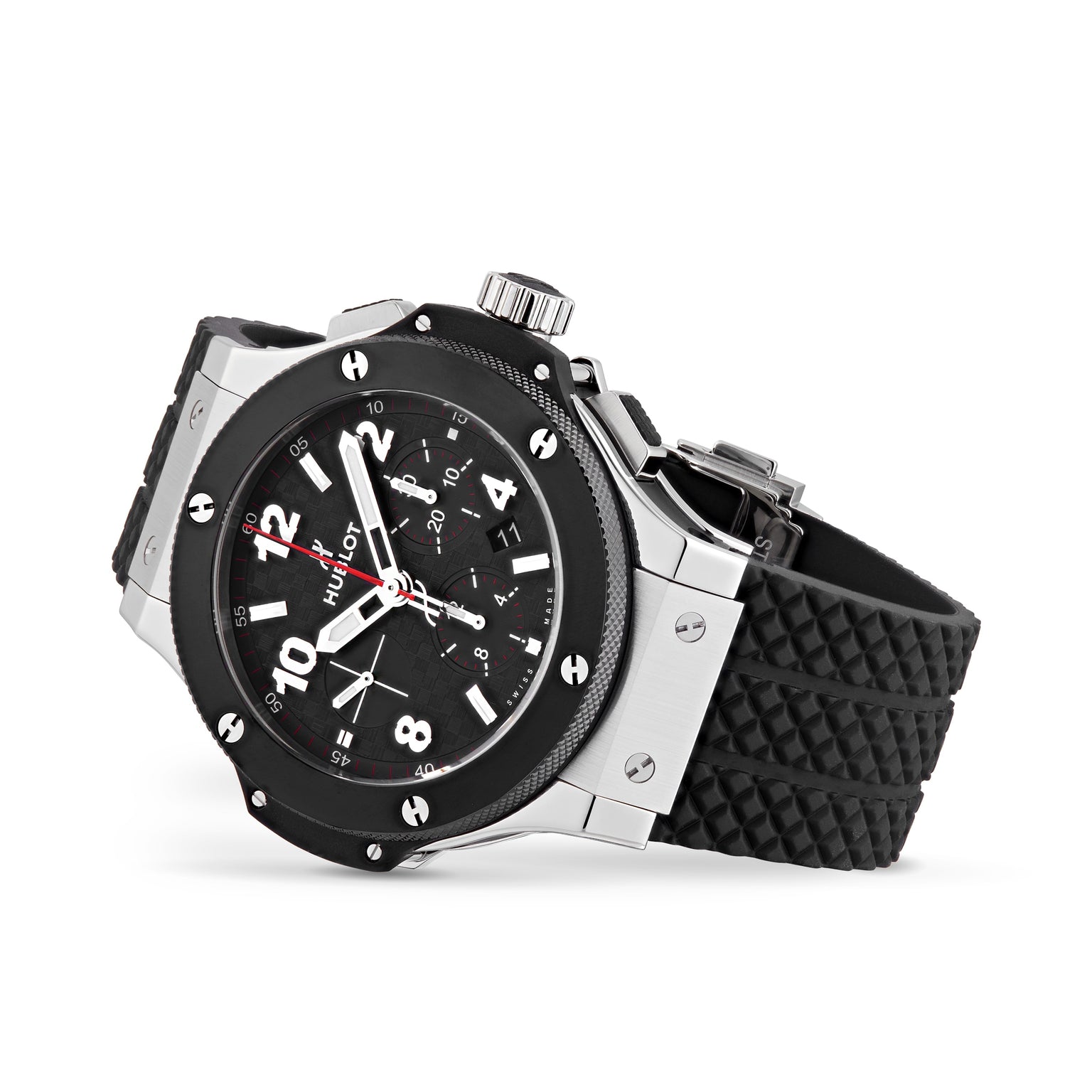 The Hublot Big Bang Original Steel Ceramic is a black and silver automatic chronograph wristwatch with a black textured rubber strap, black dial, white numerals, three subdials, and high-tech materials.