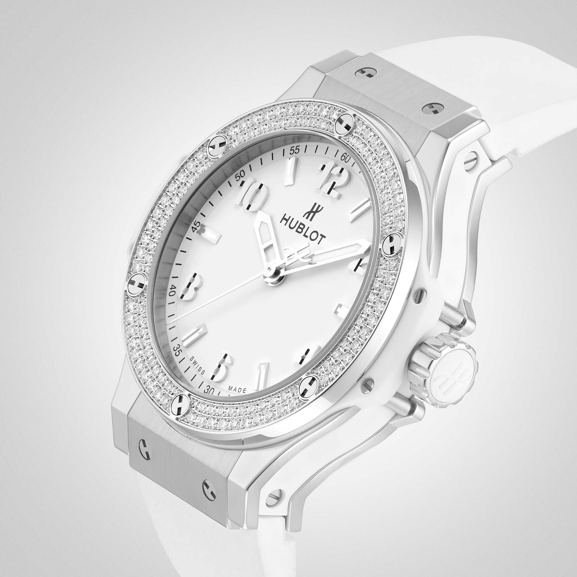 The Hublot Big Bang Steel White Diamonds watch, featuring a stainless steel bezel with 126 diamonds, white dial, and white strap, is displayed against a light gray background.