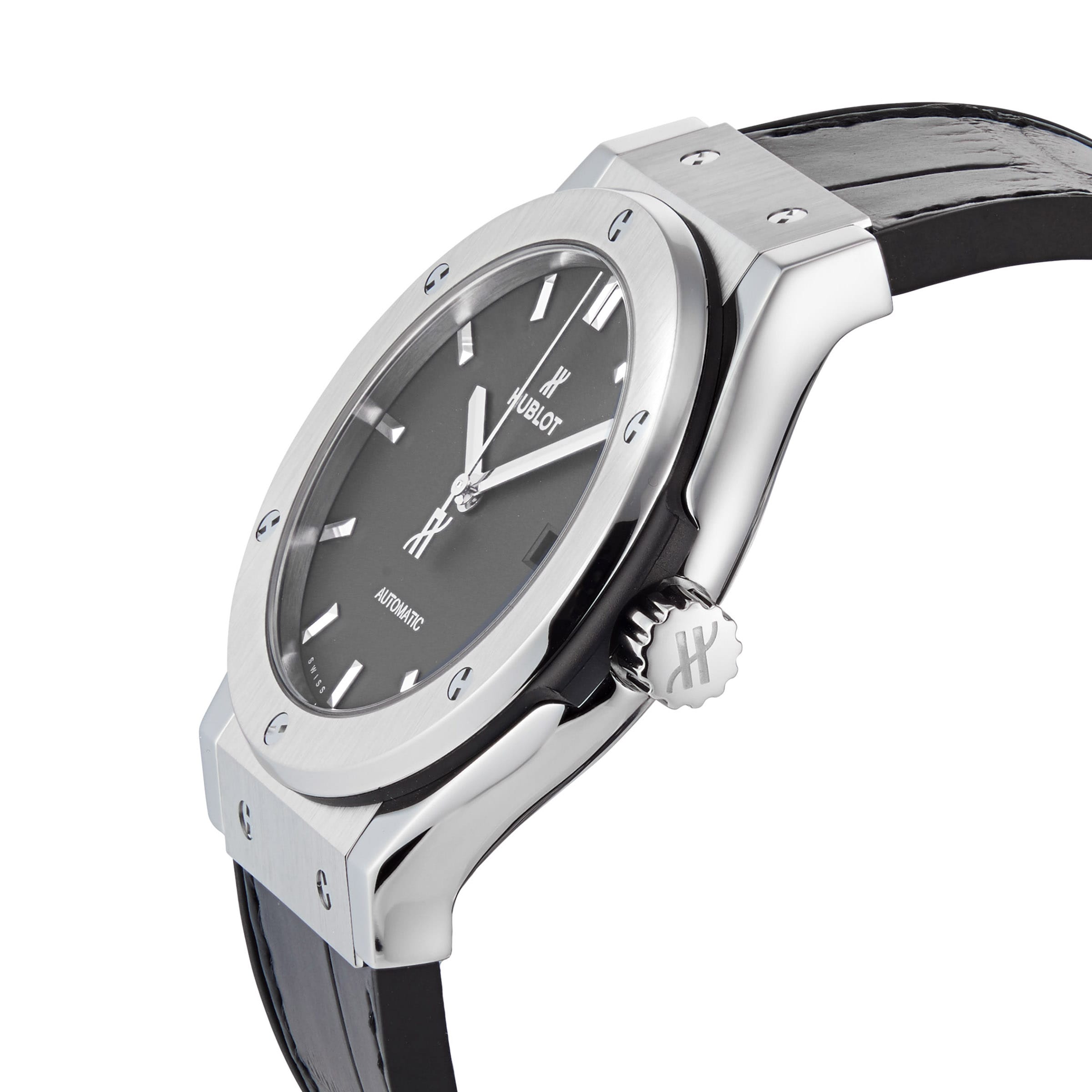 The Hublot Classic Fusion Titanium wristwatch, featuring a titanium case, black dial, silver hour markers, and a black leather strap, is displayed at an angle against a white background.