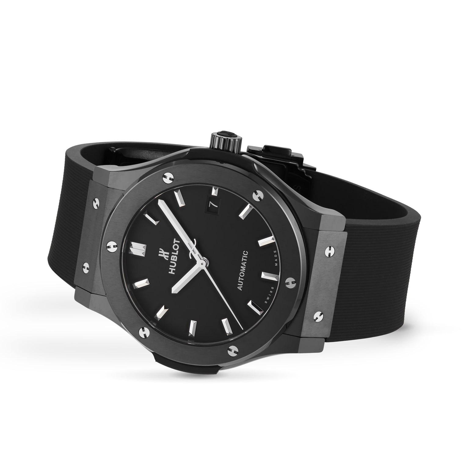 The Hublot Classic Fusion Black Magic features a black ceramic case, black rubber strap, silver hour markers and hands, and visible bezel screws, shown against a white background.