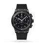 The Hublot Classic Fusion Chronograph Black Magic features a black ceramic case, black rubber strap, black dial with three subdials, date window at 6 o’clock, and silver hour markers.
