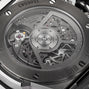 Close-up of the transparent caseback of the Hublot Big Bang Integrated Titanium, showing the detailed mechanical movement and internal gears within its titanium case and advanced self-winding chronograph.