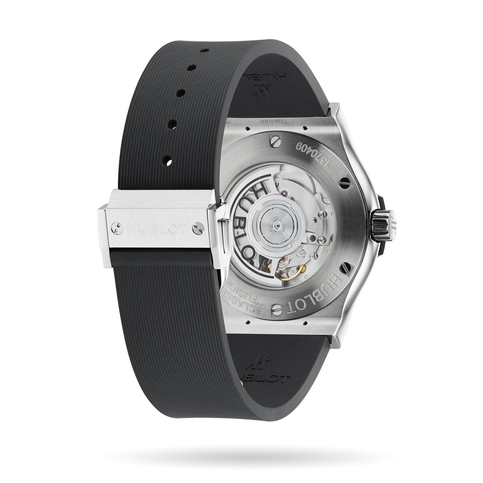 The image shows the back of a Hublot Classic Fusion Racing Grey Titanium watch, featuring a see-through case back that reveals the mechanical movement, with a titanium case and black rubber strap.