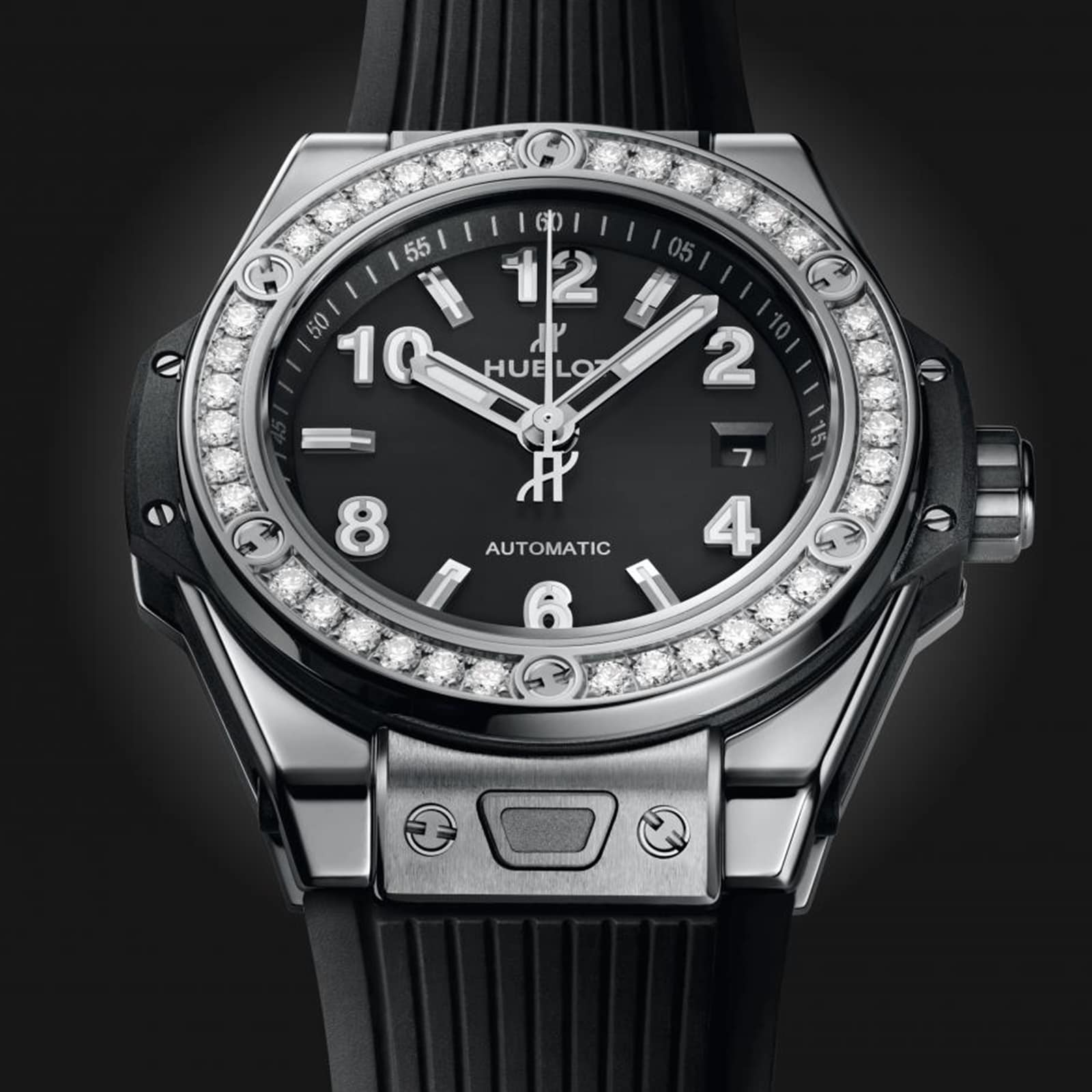 The Hublot Big Bang One Click Steel Diamonds wristwatch features a black and silver design with a diamond-studded bezel, black rubber strap, stainless steel accents, and an analog display showing 10:10.