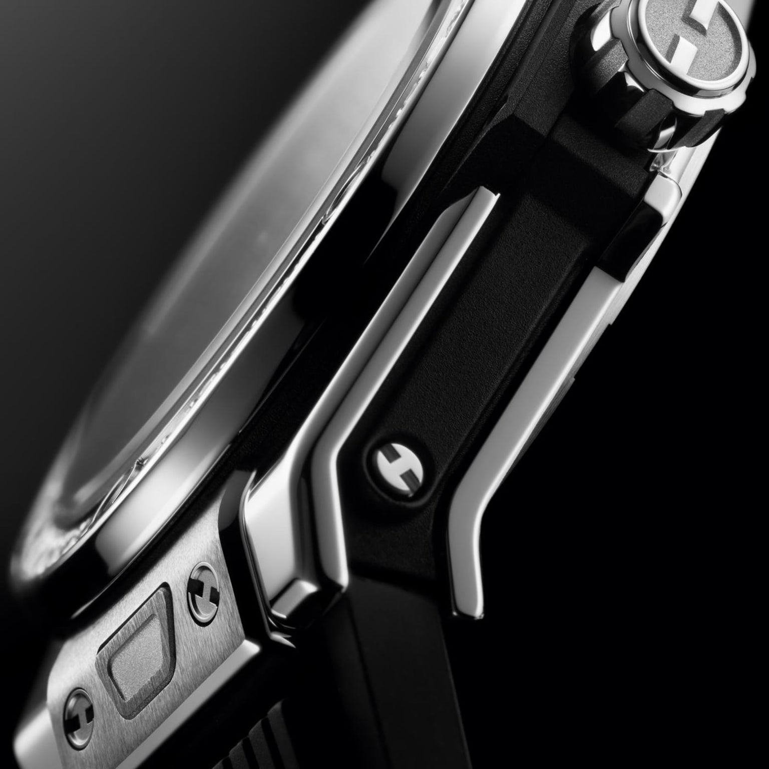 Close-up side view of the Hublot Big Bang One Click Steel Diamonds, showcasing its stainless steel case, logo-engraved crown, diamond details, and black strap with visible screws.