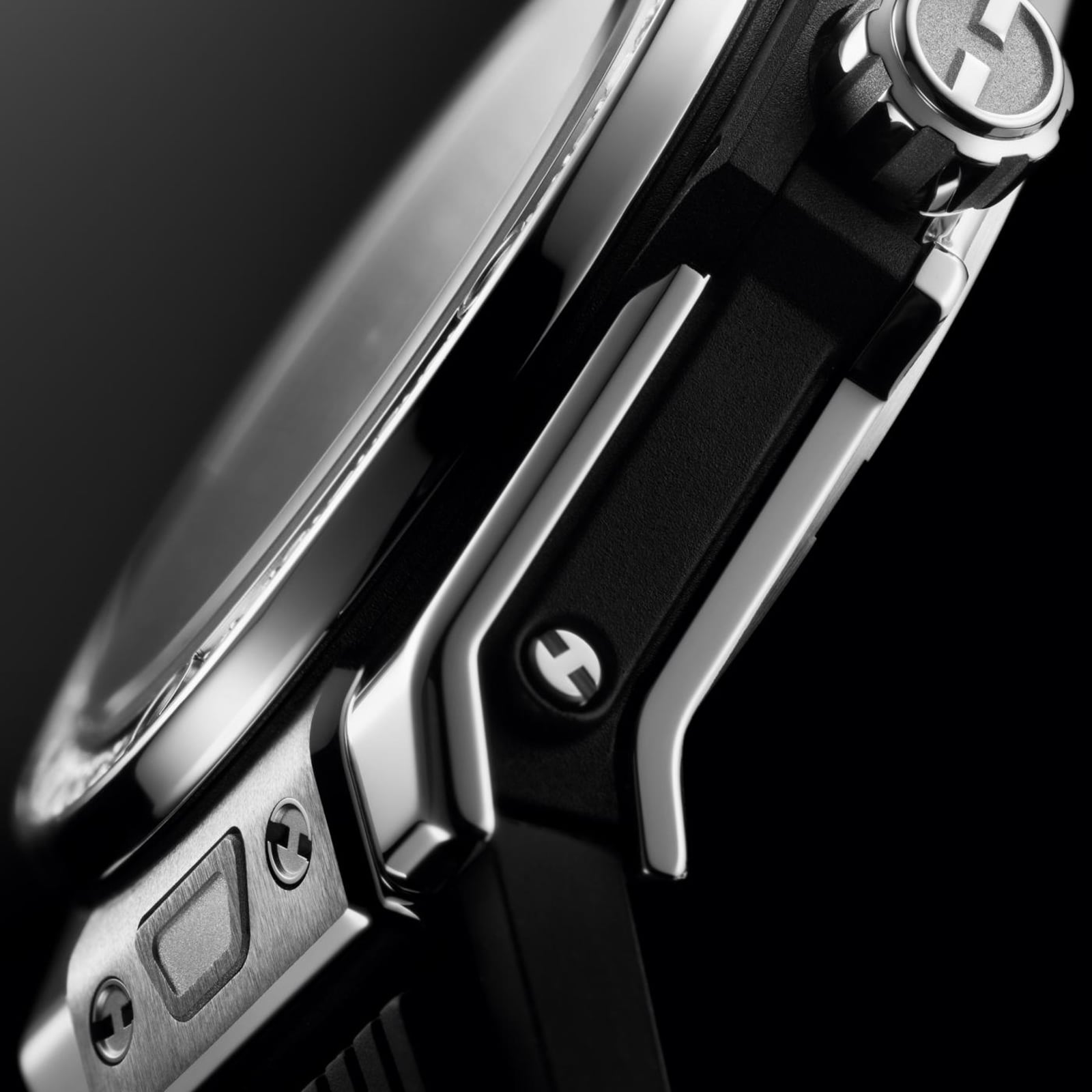 Close-up side view of the Hublot Big Bang One Click Steel Diamonds, showcasing its stainless steel case, logo-engraved crown, diamond details, and black strap with visible screws.