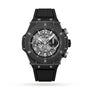 The Hublot Big Bang Unico Black Magic features a skeleton dial with silver accents, visible UNICO movement gears, and a black rubber strap, displayed against a white background.