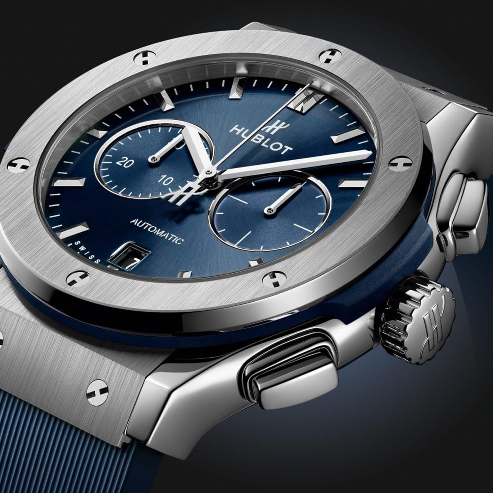 Close-up of the Hublot Classic Fusion Chronograph Titanium Blue wristwatch featuring a blue sunray dial, silver hour markers and hands, chronograph subdials, and a titanium case.