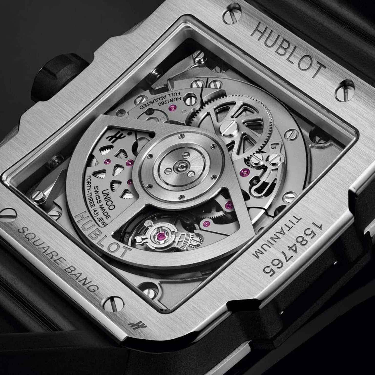 Close-up of the Hublot Square Bang Unico Titanium caseback, highlighting the detailed Unico movement and engraved specifications on its durable titanium case.