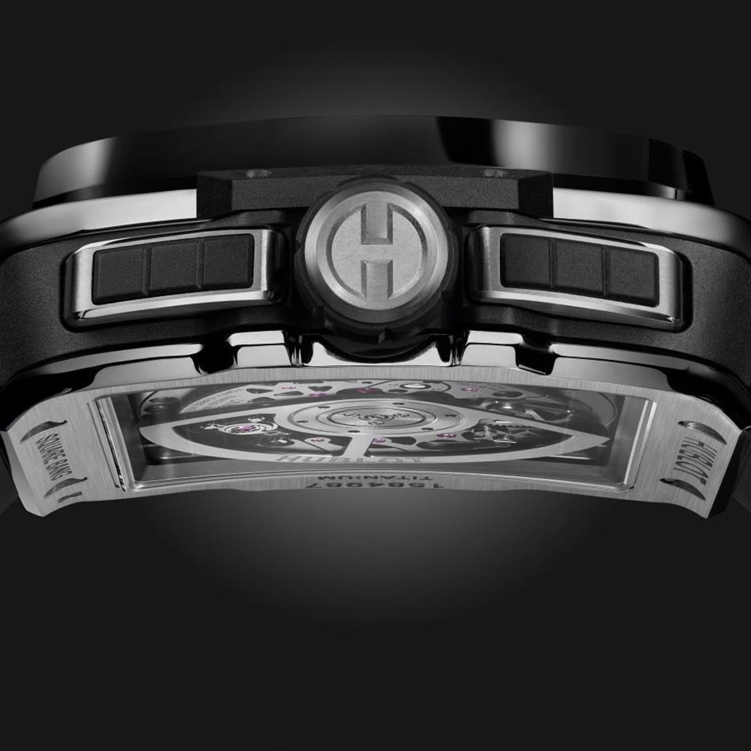 Close-up side view of the Hublot Square Bang Unico Titanium Ceramic, a black and silver luxury wristwatch, highlighting its crown, pushers, and sapphire crystal case back revealing the intricate UNICO movement.