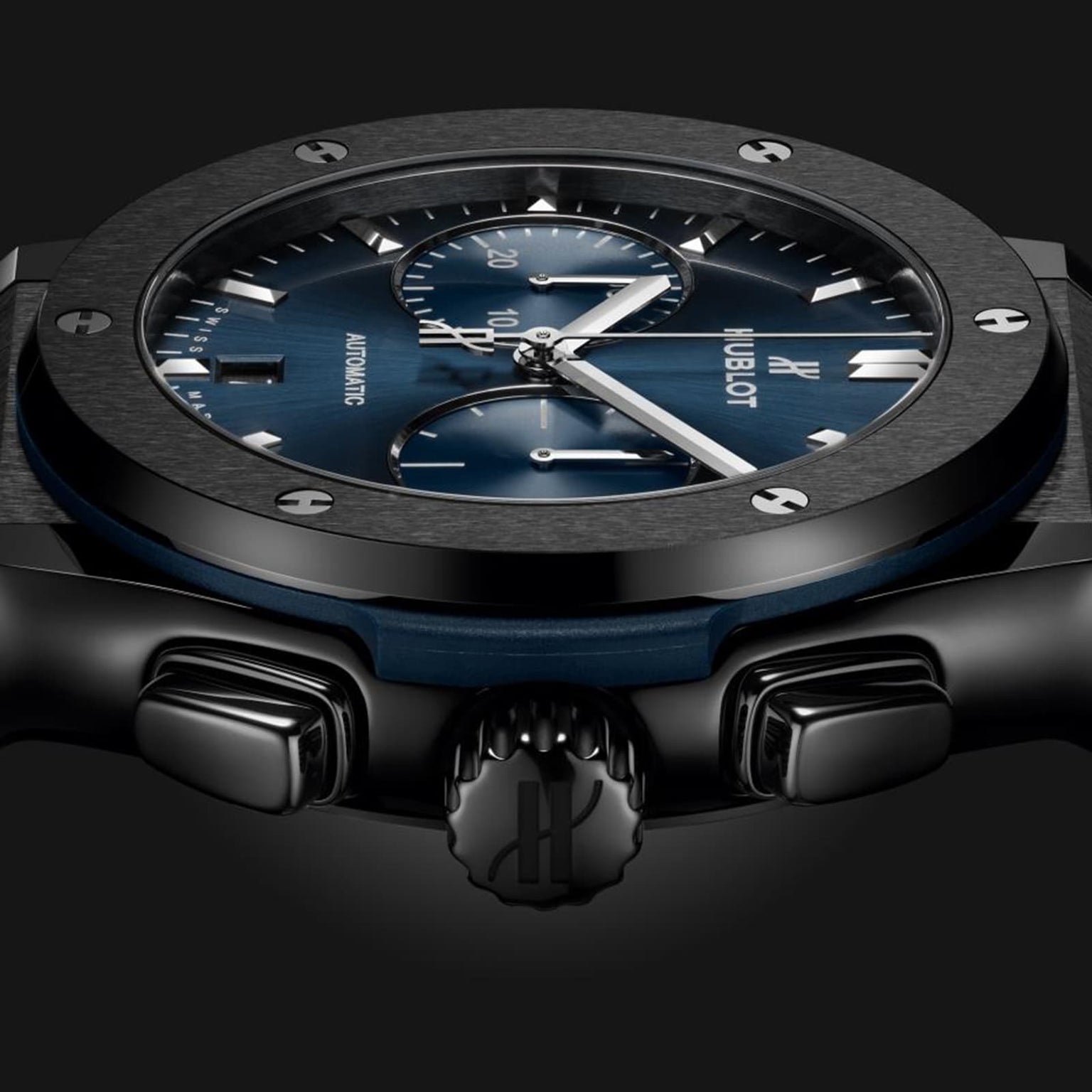 Close-up side view of the Hublot Classic Fusion Ceramic Blue Chronograph, featuring a blue sunray dial, silver hands, black bezel, and sleek black ceramic case set against a dark background.