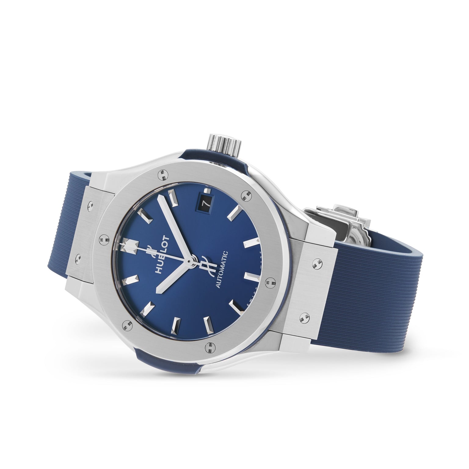 The Hublot Classic Fusion Titanium Blue wristwatch features a titanium case, blue rubber strap, silver bezel, blue dial, and silver hour markers and hands, shown on a white background.