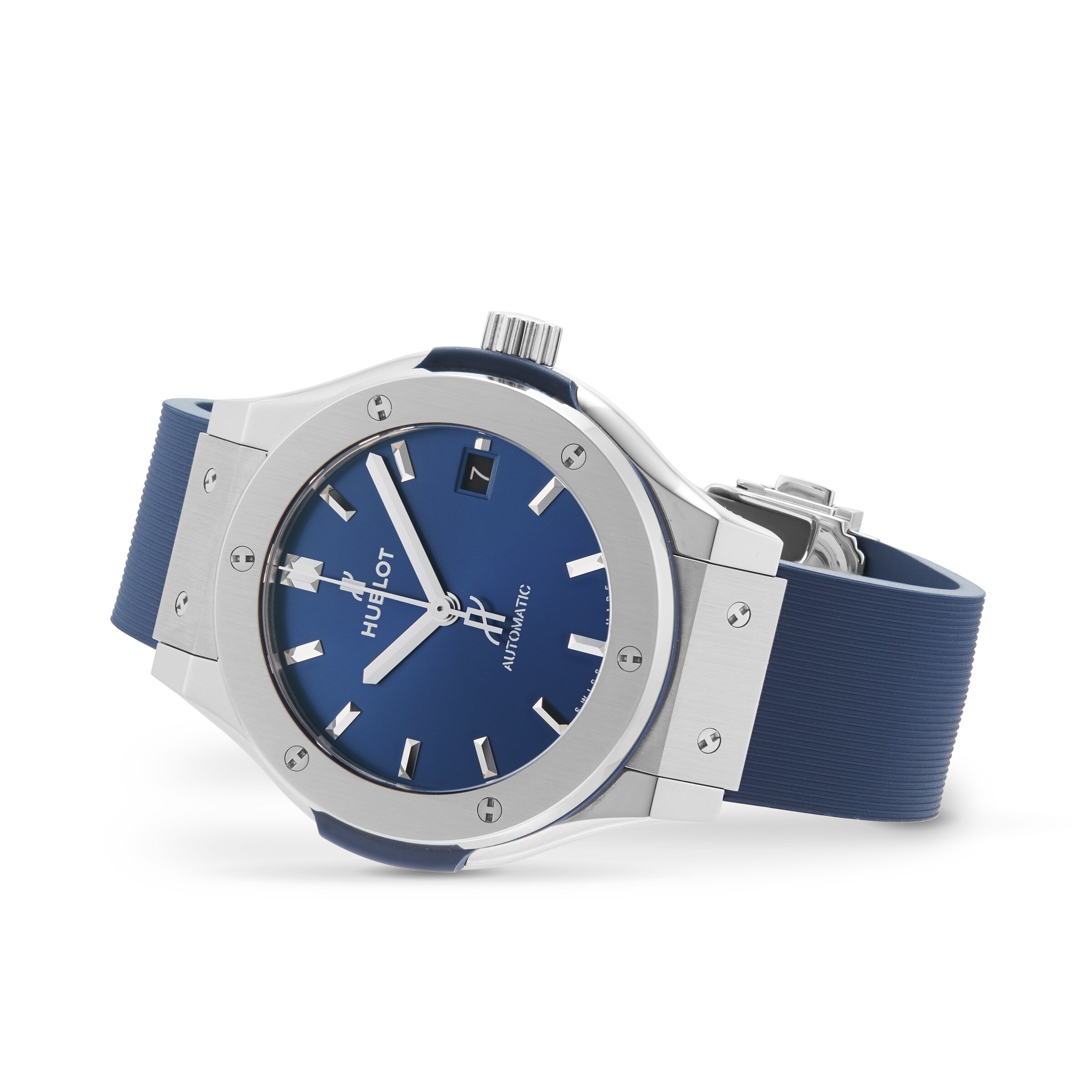 The Hublot Classic Fusion Titanium Blue wristwatch features a titanium case, blue rubber strap, silver bezel, blue dial, and silver hour markers and hands, shown on a white background.